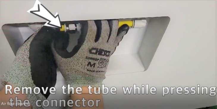 Remove tube while pressing connector